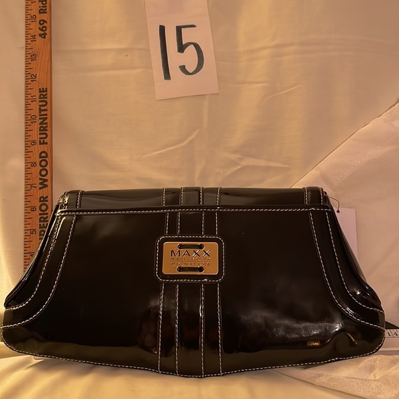Black brand new MAXX NEW YORK purse. Never used no rips, tears or damage. 14 x 7 - Picture 4 of 11